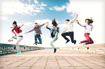 group of teenagers jumping