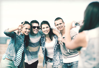 teenagers taking photo outside