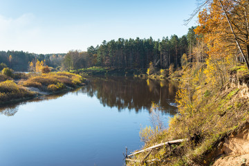 scenic autumn colored river in country