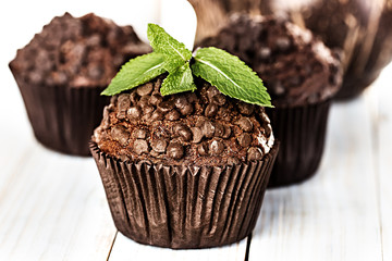 Homemade chocolate muffins in paper cupcake holder
