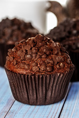 Homemade chocolate muffins in paper cupcake holder