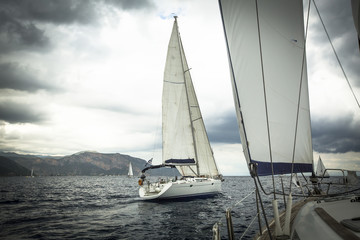 Fototapeta premium Sailing ship yachts during regatta in the sea in stormy weather.