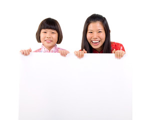 Chinese girls holding a white board