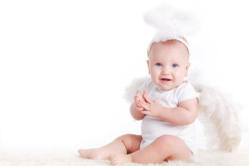 Cute infant baby with angel wings and nimbus isolated on white
