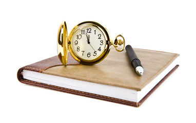 pen, clock and notebook