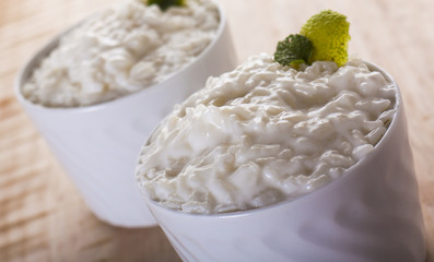 Creamy rice pudding sprinkled with cinnamon