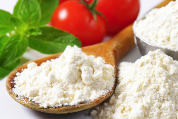 Wheat flour on wooden spoon