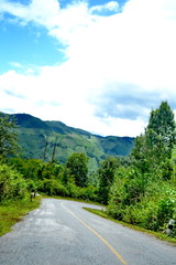 Fototapeta premium Long winding dirt road in the Mountains