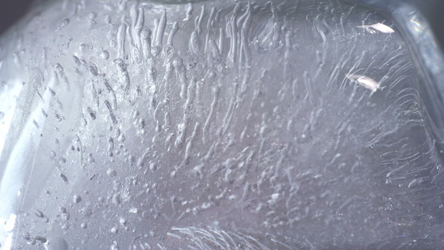Thawing ice close-up timelapse
