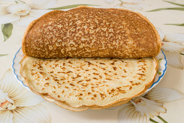 a pile of freshly cooked pancakes on a plate