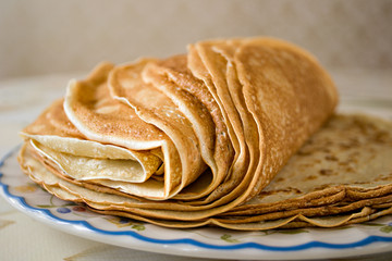 a pile of freshly cooked pancakes on a plate