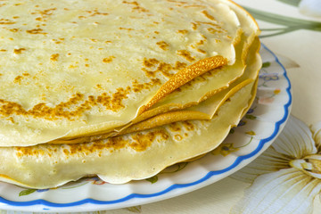 a pile of freshly cooked pancakes on a plate
