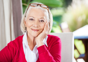 Smiling Senior Woman Sitting At Nursing Home