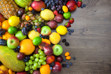 Mix of Fresh Fruits  on dark wooden table