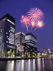 Fireworks celebrating over Tokyo cityscape at nigh