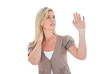 Obraz premium Happy blonde holding up her hand