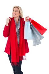 Blonde in winter clothes holding shopping bags