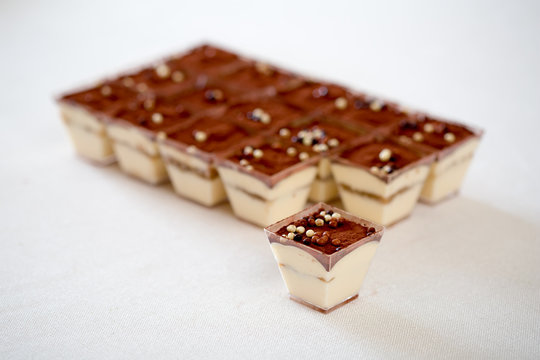 Verine - sweet tiramisu desserts at white table
