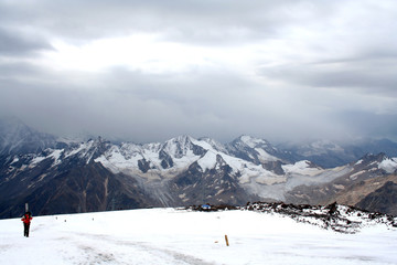 Fototapeta na wymiar Ice slope of Mount Elbrus against the Big Caucasian spine