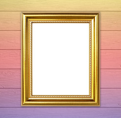golden frame on colorful wood wall background