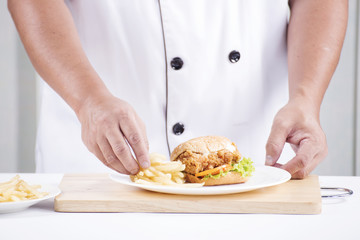 chef preparing a burger