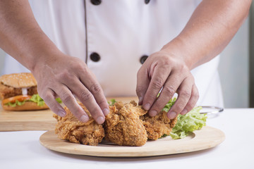 chef preparing fried chicken