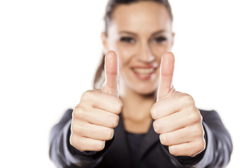 Beautiful business woman showing thumbs up