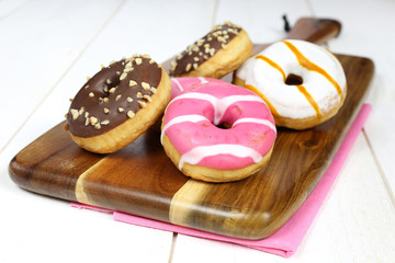 Donuts, sweet doughnut colored, glazed