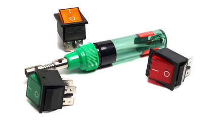compact gas soldering iron and switch on a white background