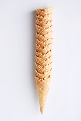 row of empty ice cream cone on white background