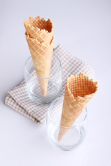 empty ice cream cones in glasses on white background