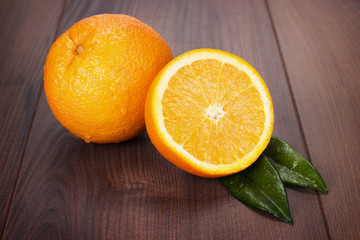 fresh oranges on brown wooden table