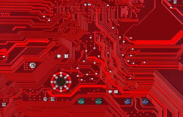 Close up of a printed red computer circuit board