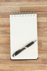 notebook on wooden table