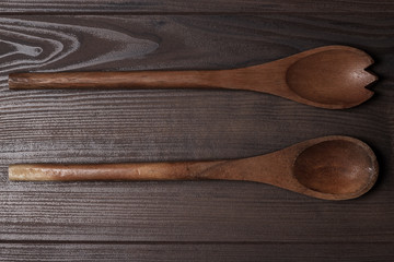 two wooden spoons on brown table