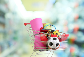 Shopping concept. Shopping cart with sport equipment