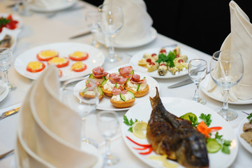 table set service with silverware and glass stemware at restaurant before party
