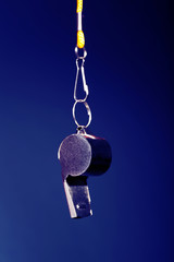 Sport metal whistle on color background