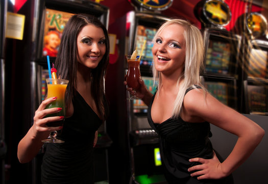 Happy girls drinking cocktails