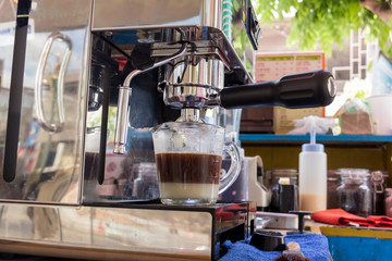 stainless spoon and coffee machine