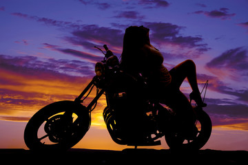 Plakat silhouette woman sit backward on motorcycle