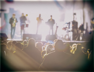 Crowd and Rock Band at Night Concert.
