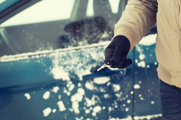 closeup of man hand with car key outdoors