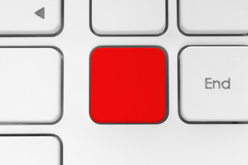 Blank red button on the keyboard close-up.