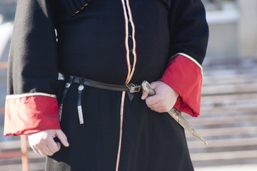 Рука казака на кинжале. Крупный план