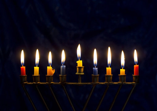Hanukkah menorah on a dark blue background