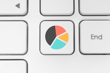 Keyboard key with graph icon.