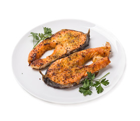 Baked trout slices isolated on white background