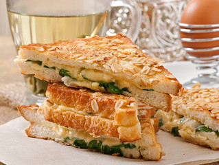 Warm toast with cheese and spinach for breakfast