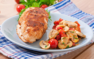 Chicken fillet in crispy breadcrumbs garnished with mushrooms an